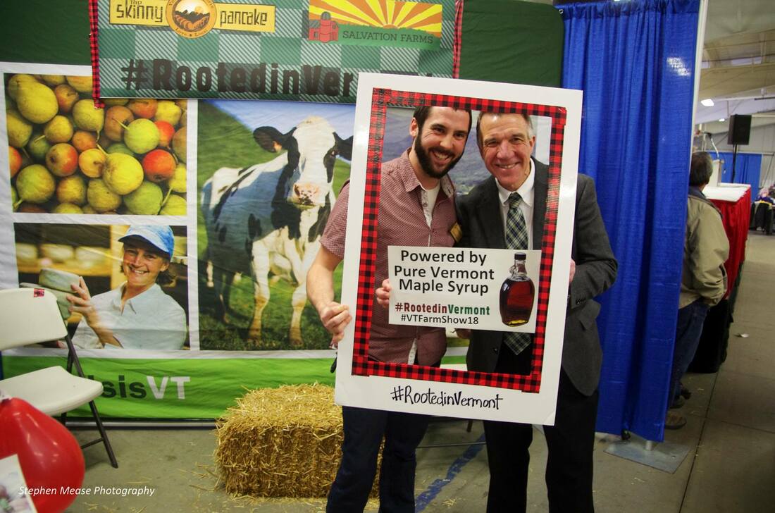 VT Farm Show vendor with Governor Phil Scott